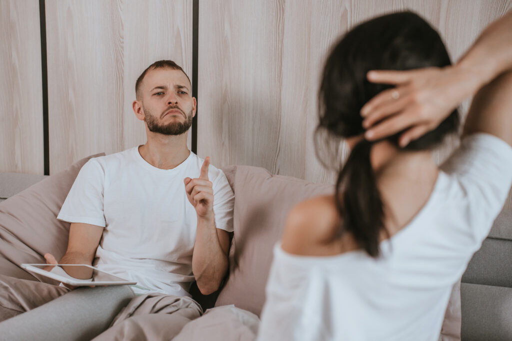 Grumpy man tells woman no showing his finger